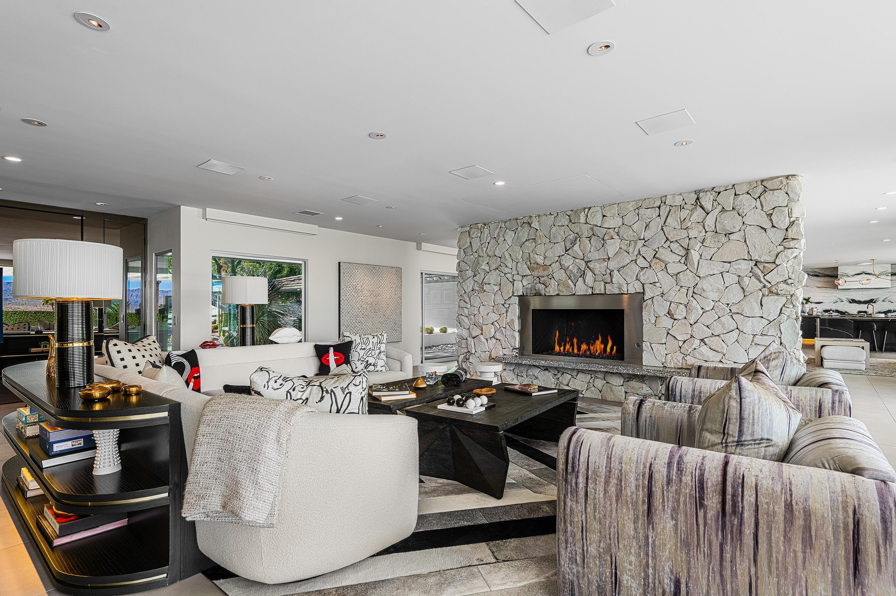 70260 Carson Road Rancho Mirage, CA 92270 - Photo 6 of 80 a living room with furniture and a fireplace