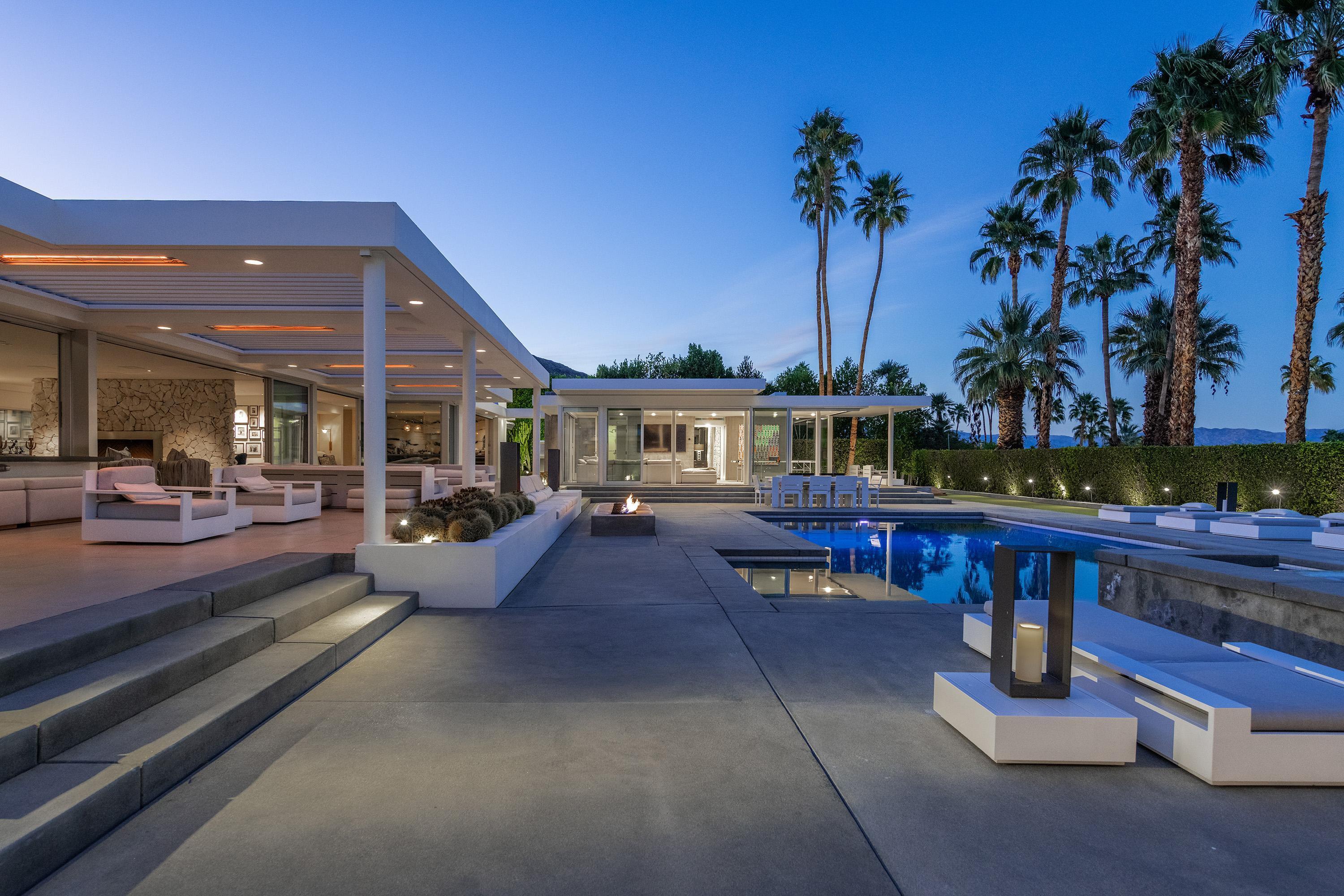 70260 Carson Road Rancho Mirage, CA 92270 - Photo 73 of 80 a view of a swimming pool with a table and chairs