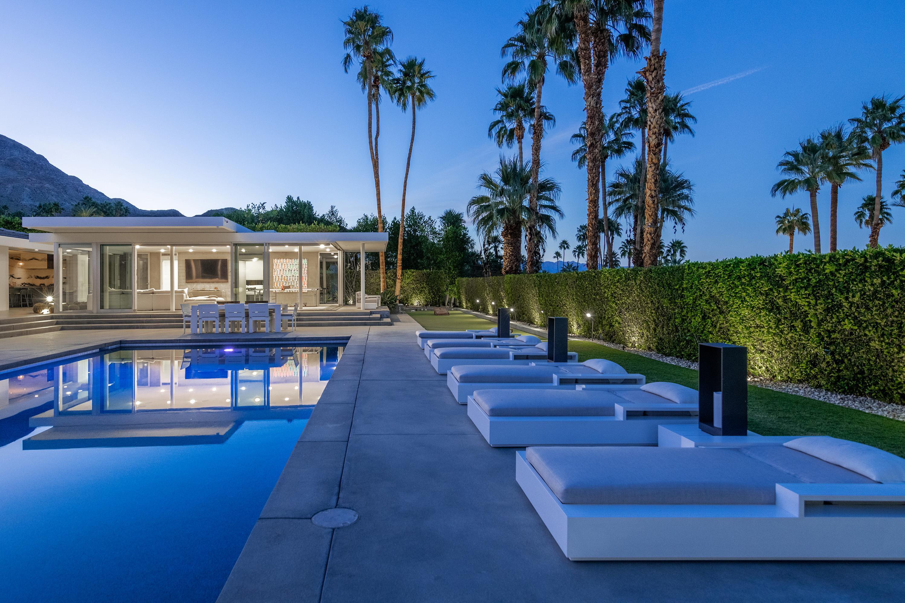 70260 Carson Road Rancho Mirage, CA 92270 - Photo 77 of 80 a view of a house with swimming pool and sitting area