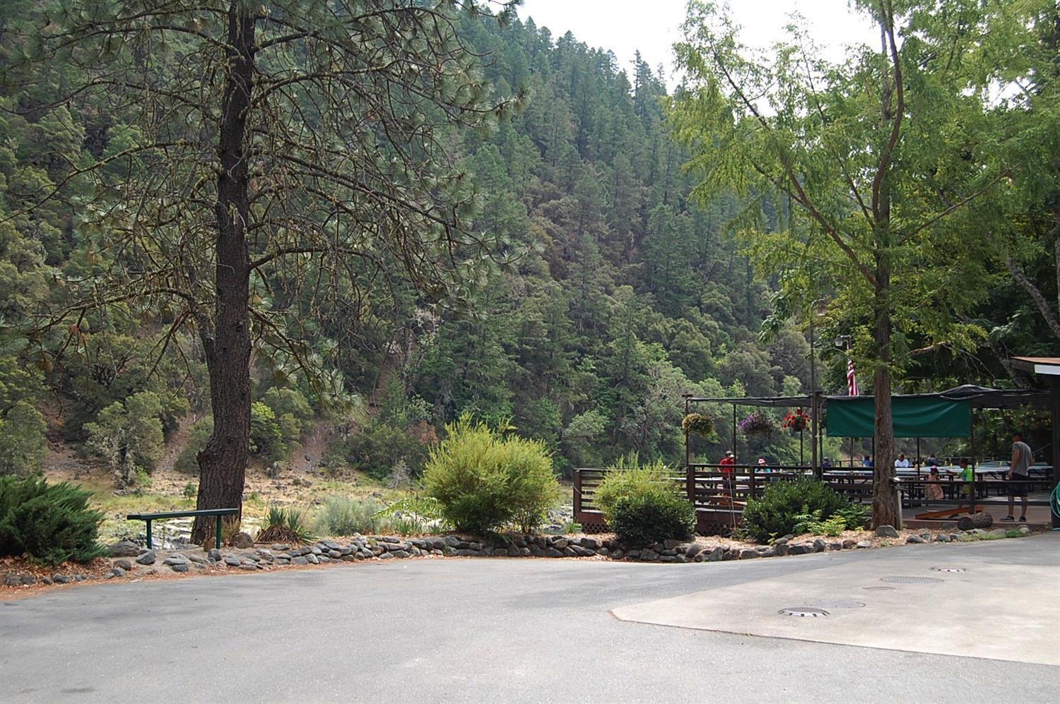12221 Galice Road Merlin, OR 97532 - Photo 31 of 35 a view of street with a building and trees in the background