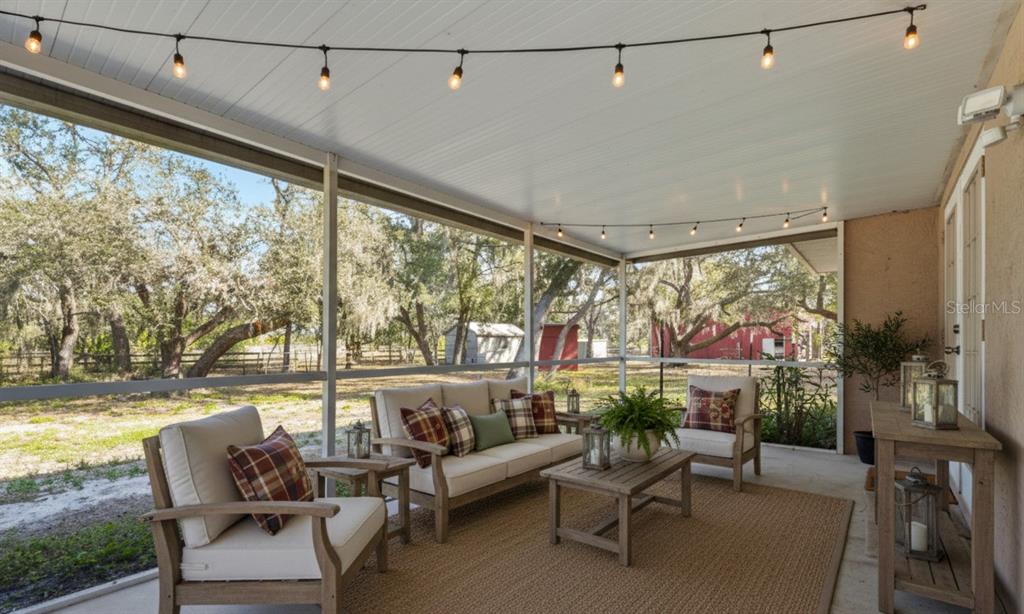 23655 Jennings Road Myakka City, FL 34251 - Photo 1 of 43 a living room with furniture and a large window