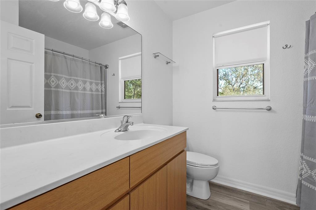 23655 Jennings Road Myakka City, FL 34251 - Photo 14 of 43 a bathroom with a sink a toilet and shower
