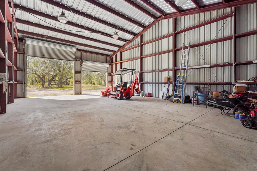 23655 Jennings Road Myakka City, FL 34251 - Photo 17 of 43 a view of a garage with furniture