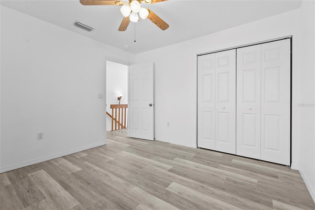 23655 Jennings Road Myakka City, FL 34251 - Photo 40 of 43 a view of an empty room and chandelier fan
