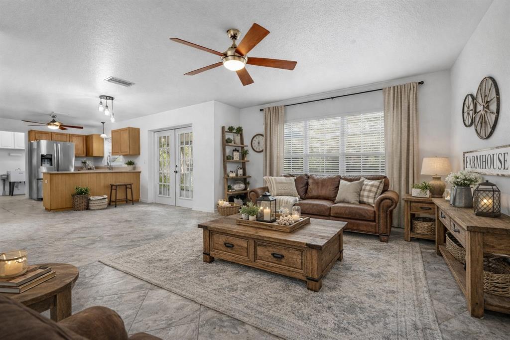 23655 Jennings Road Myakka City, FL 34251 - Photo 4 of 43 a living room with furniture and fireplace