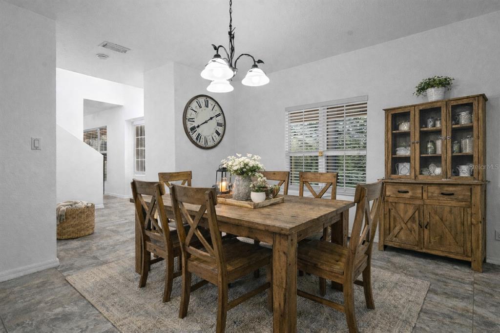 23655 Jennings Road Myakka City, FL 34251 - Photo 6 of 43 a view of a dining area with furniture and a large window