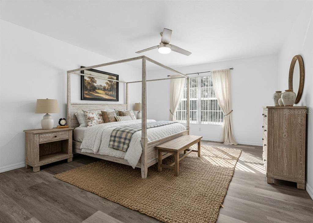 23655 Jennings Road Myakka City, FL 34251 - Photo 9 of 43 a bedroom with a bed wooden floor and window