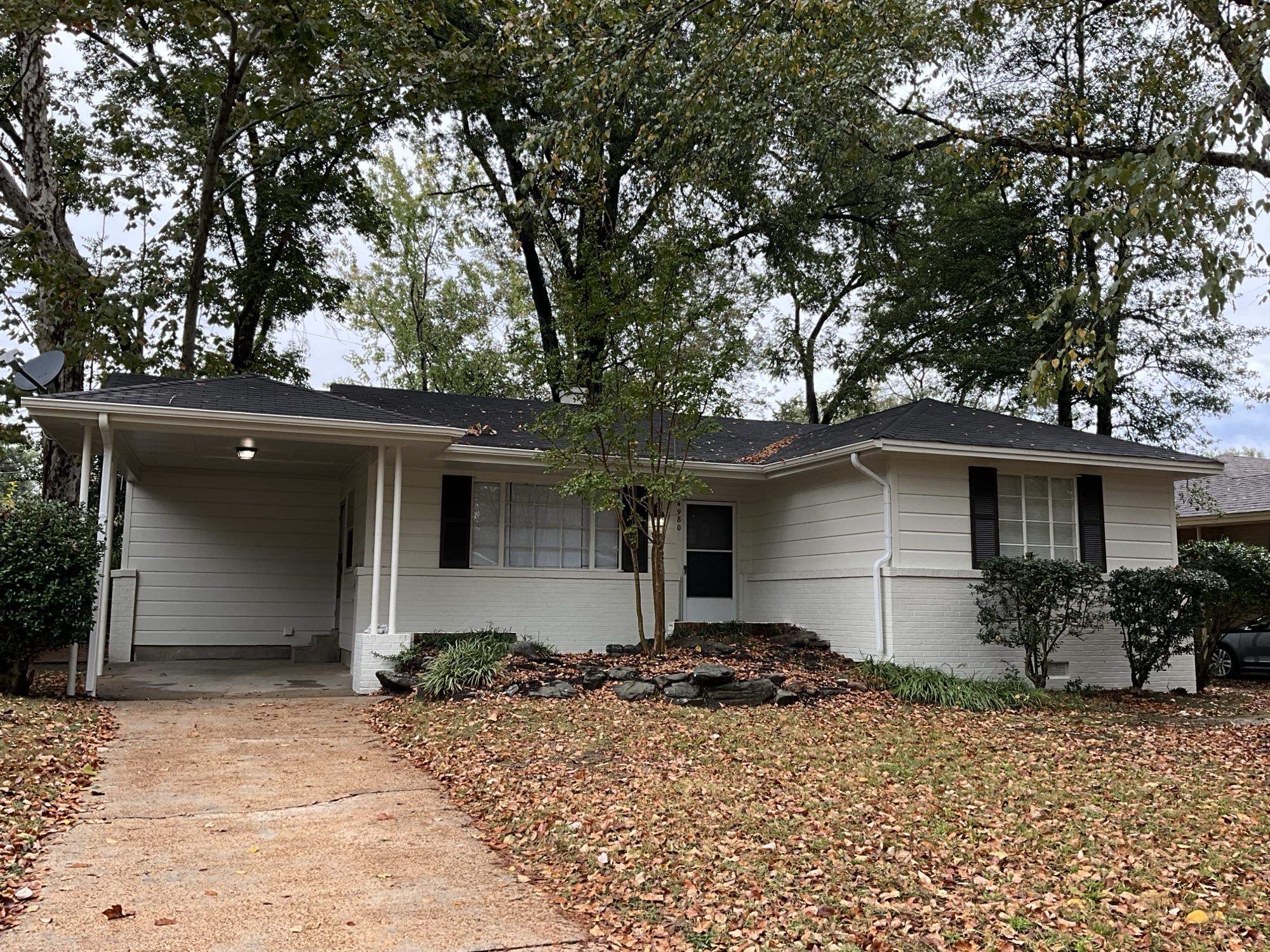 a house with trees in the background