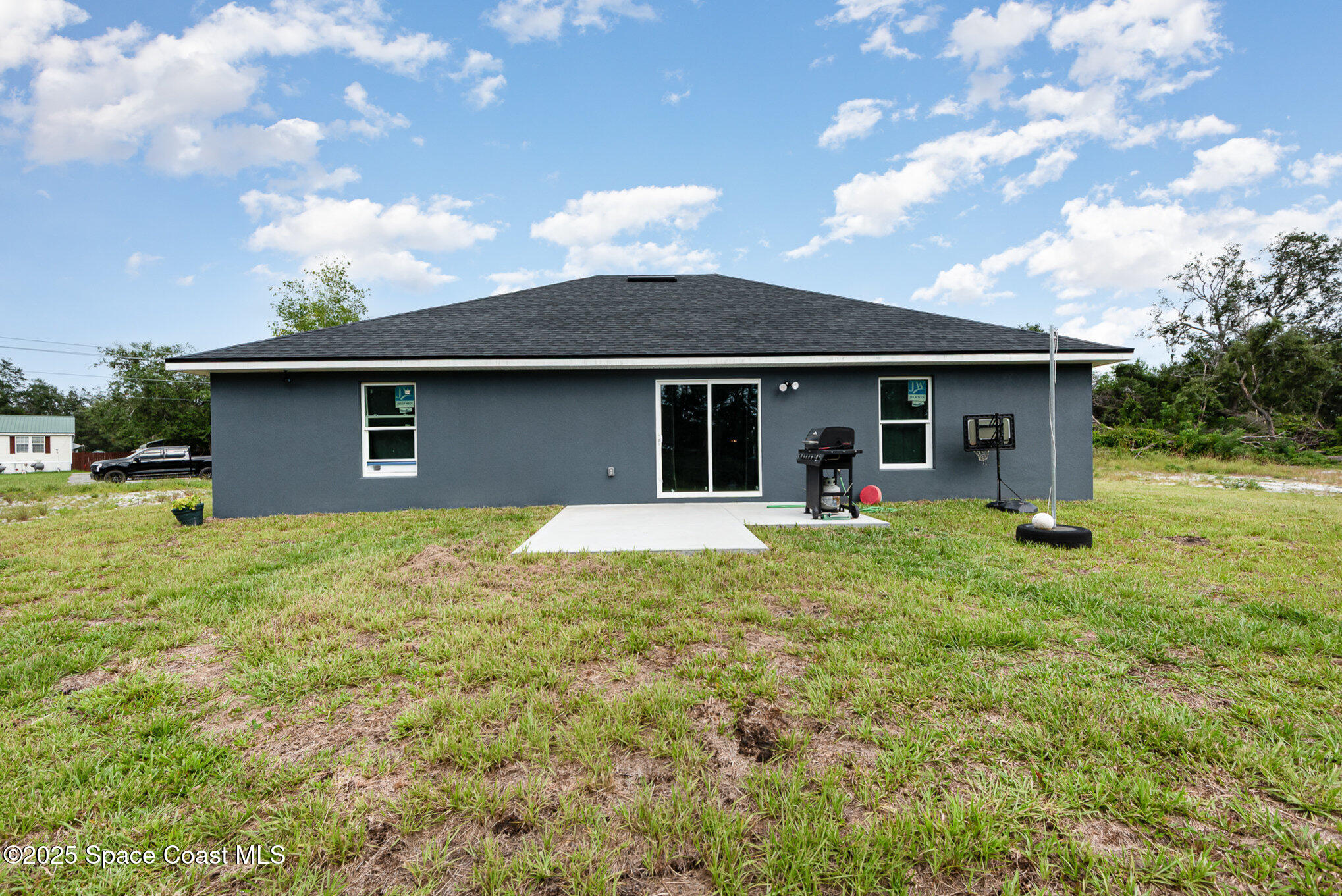 4110 Hog Valley Road Mims, FL 32754 - Photo 13 of 13 a view of a house with backyard porch and garden