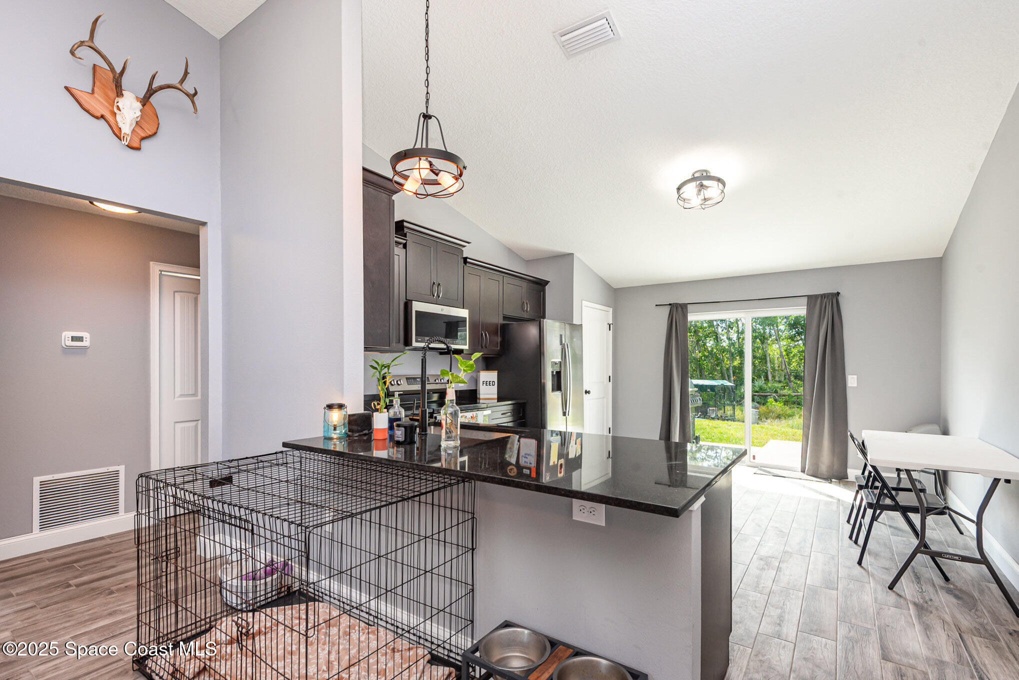 4110 Hog Valley Road Mims, FL 32754 - Photo 5 of 13 a view of a dining room with furniture window and outside view
