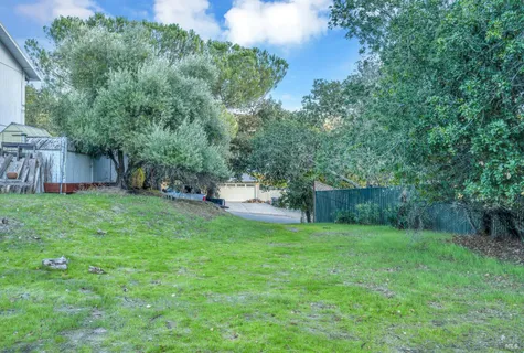 a view of a backyard with a small cabin