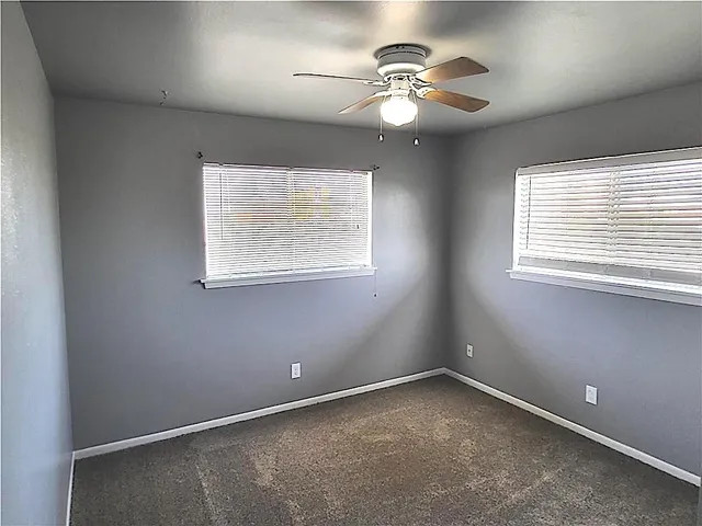 en view of an empty room with a window