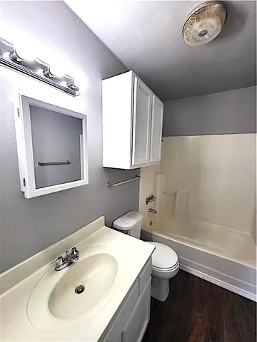 a bathroom with a sink a toilet and a bathtub
