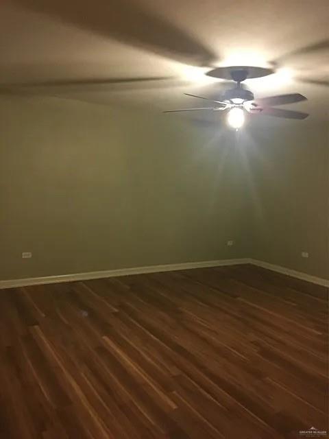 413 Uvalde Avenue McAllen, TX 78503 - Photo 11 of 20 a view of an empty room with wooden floor