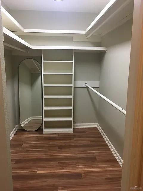 413 Uvalde Avenue McAllen, TX 78503 - Photo 14 of 20 a view of walk in closet with empty racks