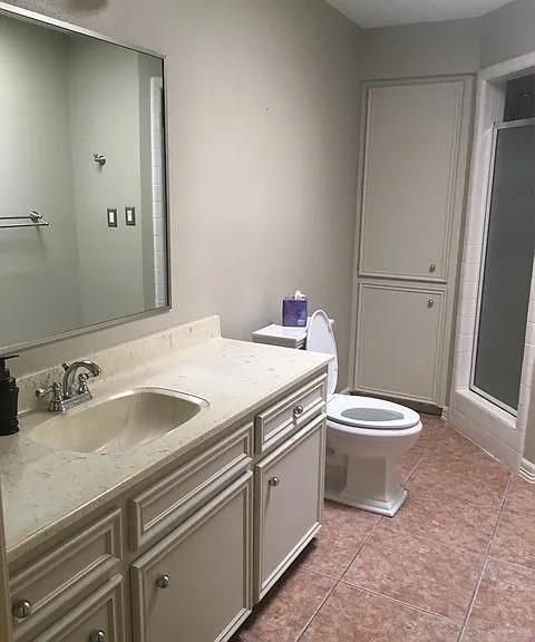 413 Uvalde Avenue McAllen, TX 78503 - Photo 19 of 20 a bathroom with a sink a toilet and a mirror