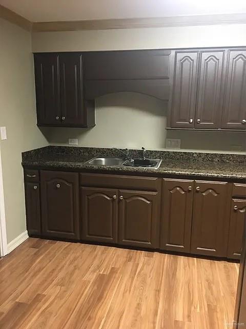 413 Uvalde Avenue McAllen, TX 78503 - Photo 20 of 20 a kitchen with granite countertop a stove top oven
