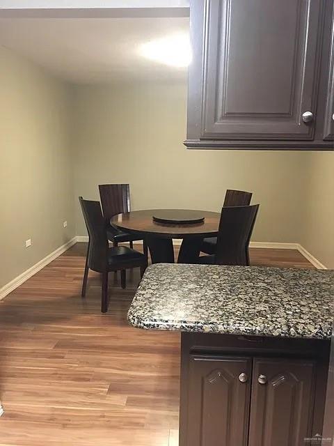 413 Uvalde Avenue McAllen, TX 78503 - Photo 4 of 20 a living room with a wooden floor and furniture