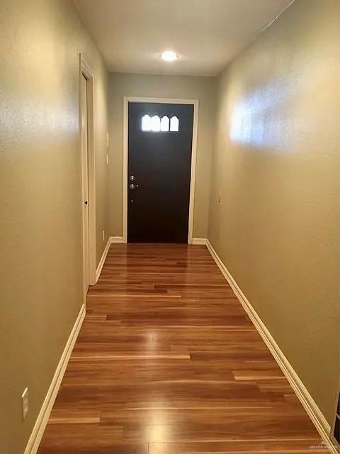 413 Uvalde Avenue McAllen, TX 78503 - Photo 6 of 20 a view of a hallway with wooden floor