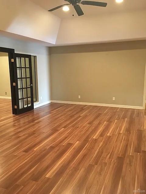 413 Uvalde Avenue McAllen, TX 78503 - Photo 8 of 20 a view of an empty room with wooden floor and a window