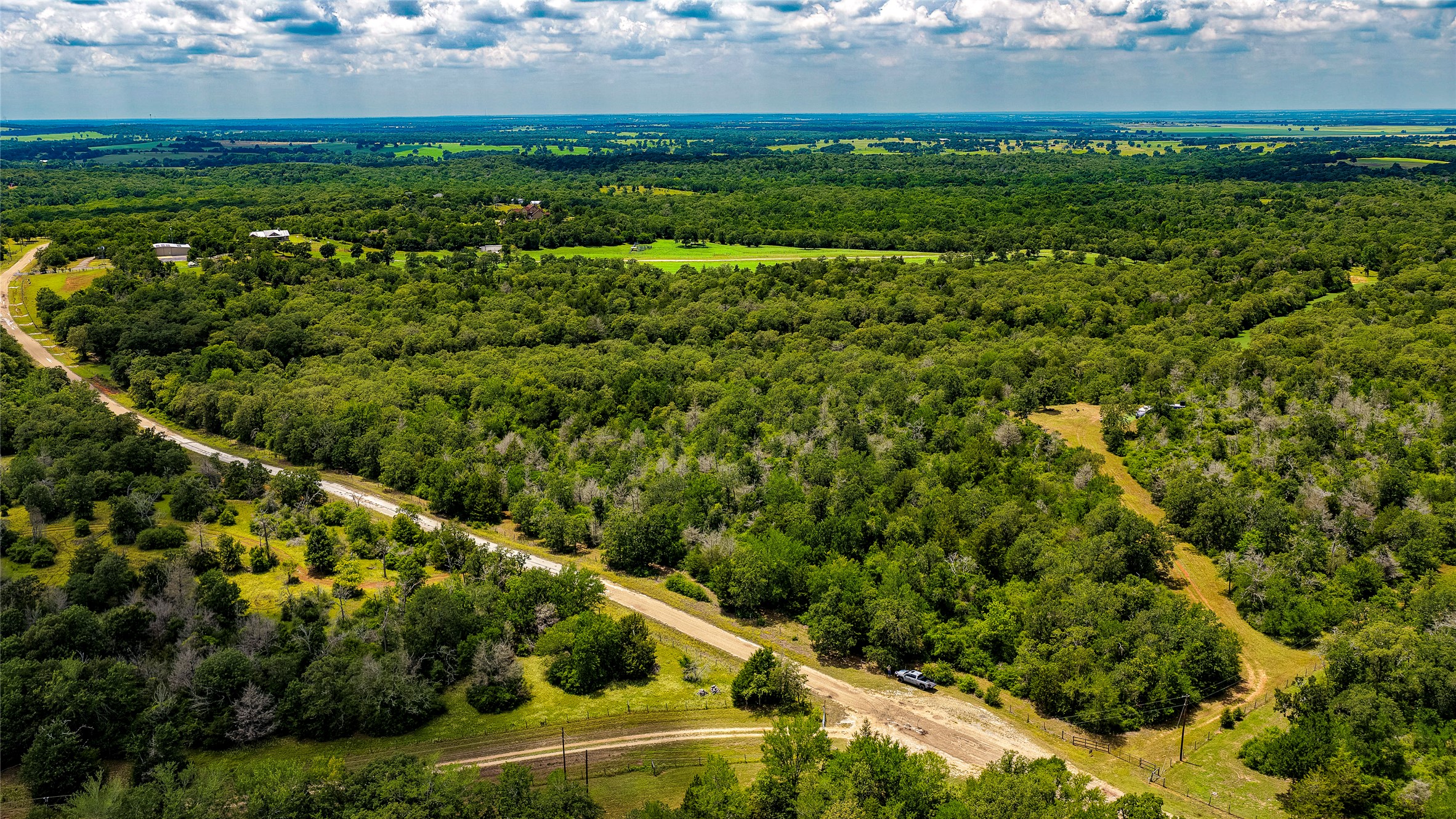 1470 22 Hills Road Gause, TX 77857 - Photo 1 of 35 An aerial perspective reveals abundant natural beauty across sprawling, verdant landscapes.