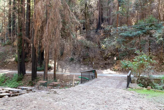 a backyard of a house with a yard and outdoor seating