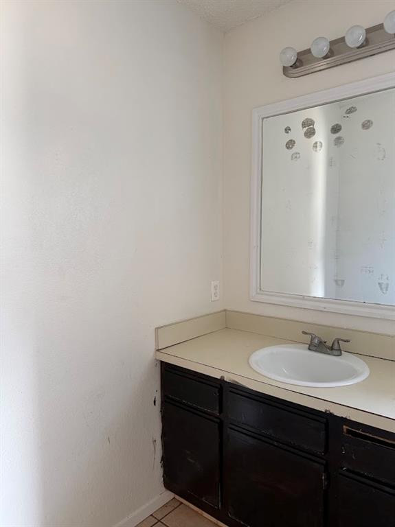 11204 Liberty School Road Pelican Bay, TX 76020 - Photo 15 of 23 a bathroom with a sink and a mirror