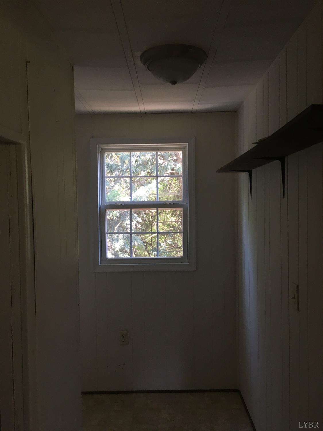 1066 Stevens Cove Road Lovingston, VA 22949 - Photo 12 of 15 a view of a room that has a window in it
