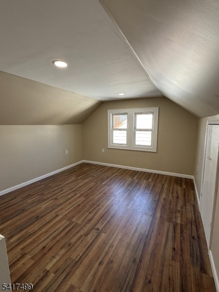 335 Hobson Street Newark, NJ 07112 - Photo 21 of 29 an empty room with wooden floor and windows