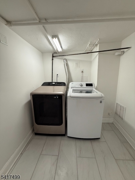 335 Hobson Street Newark, NJ 07112 - Photo 25 of 29 a utility room with washer and dryer