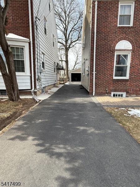 335 Hobson Street Newark, NJ 07112 - Photo 3 of 29 a front view of a house with a yard