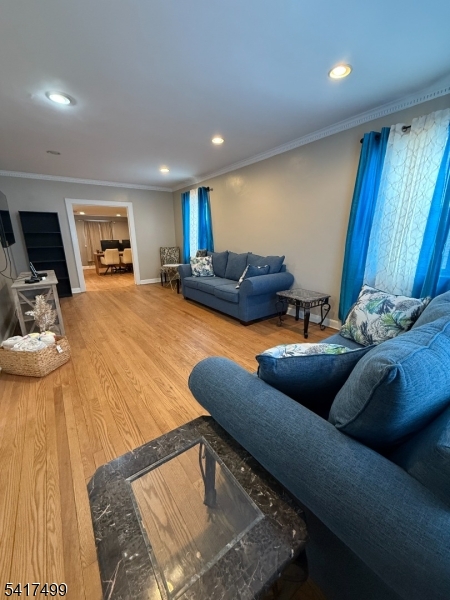 335 Hobson Street Newark, NJ 07112 - Photo 5 of 29 a living room with furniture and a wooden floor