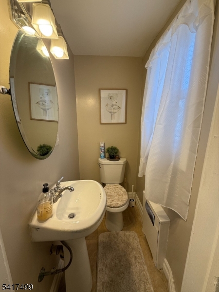 335 Hobson Street Newark, NJ 07112 - Photo 6 of 29 a bathroom with a sink mirror and toilet