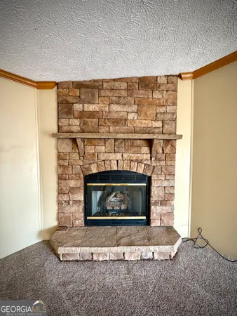 a living room with a fireplace