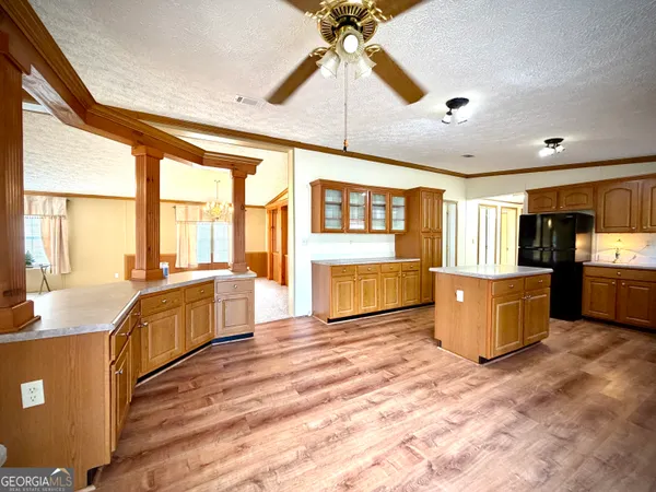 a kitchen with stainless steel appliances granite countertop a stove top oven and sink