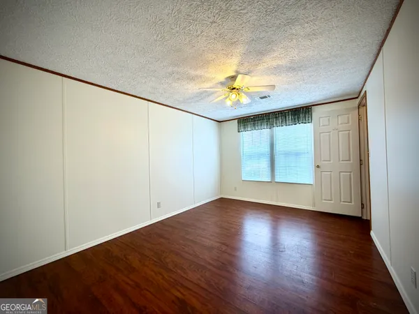a bathroom with a toilet sink and a mirror