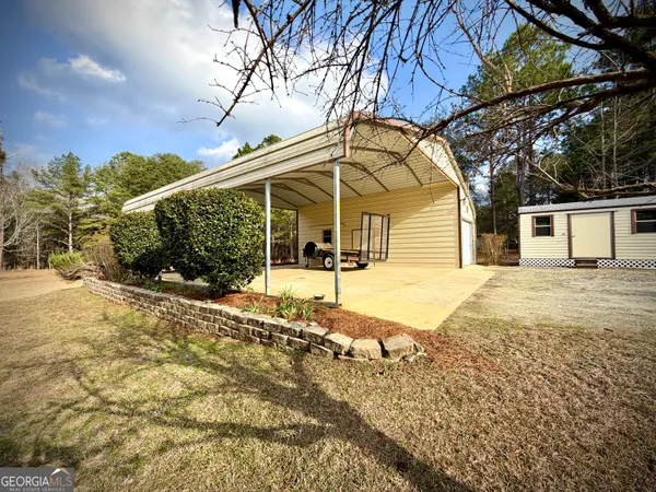 a backyard of apartments with trees
