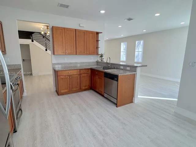 a view of a hallway with stairs