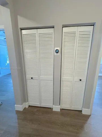 a bathroom with a glass shower door