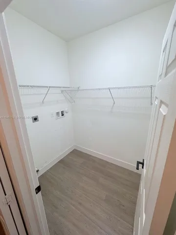 a bathroom with a double vanity sink a mirror and a bathtub