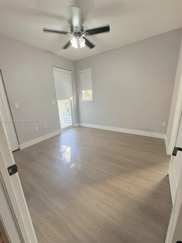 an aerial view of a house with a lot of trees all around