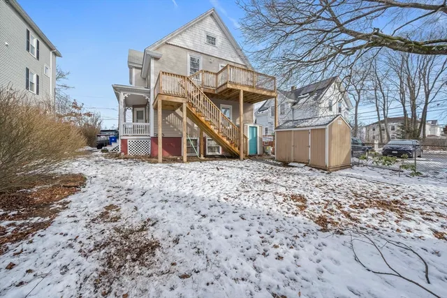 a view of a wooden house with a yard