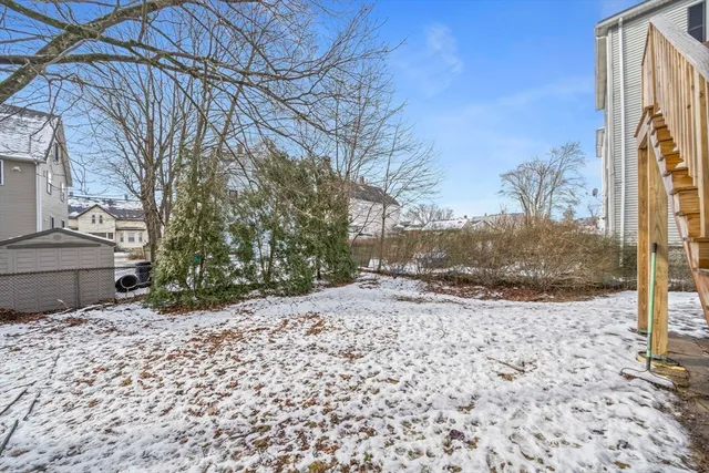 a view of a backyard of the house