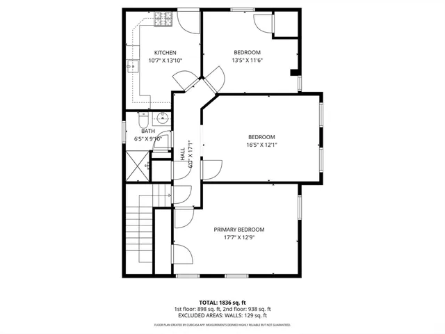 a picture of a bench in front of a wall