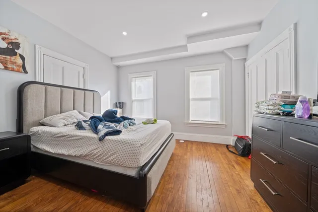 a bed room with a bed and a window