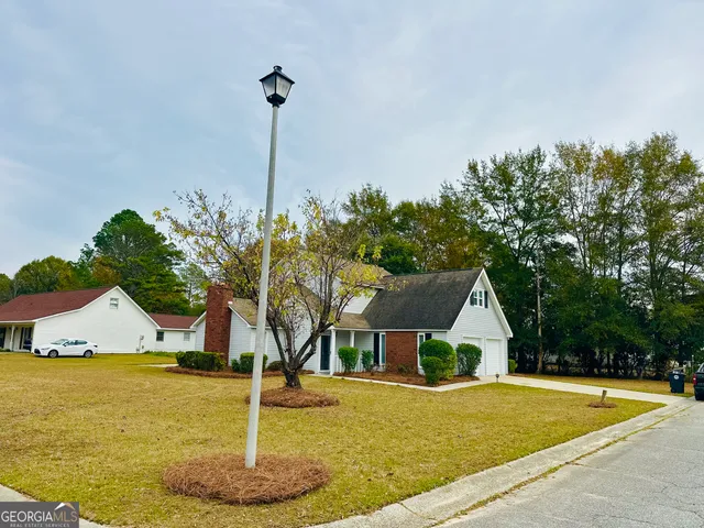a front view of a house with a yard