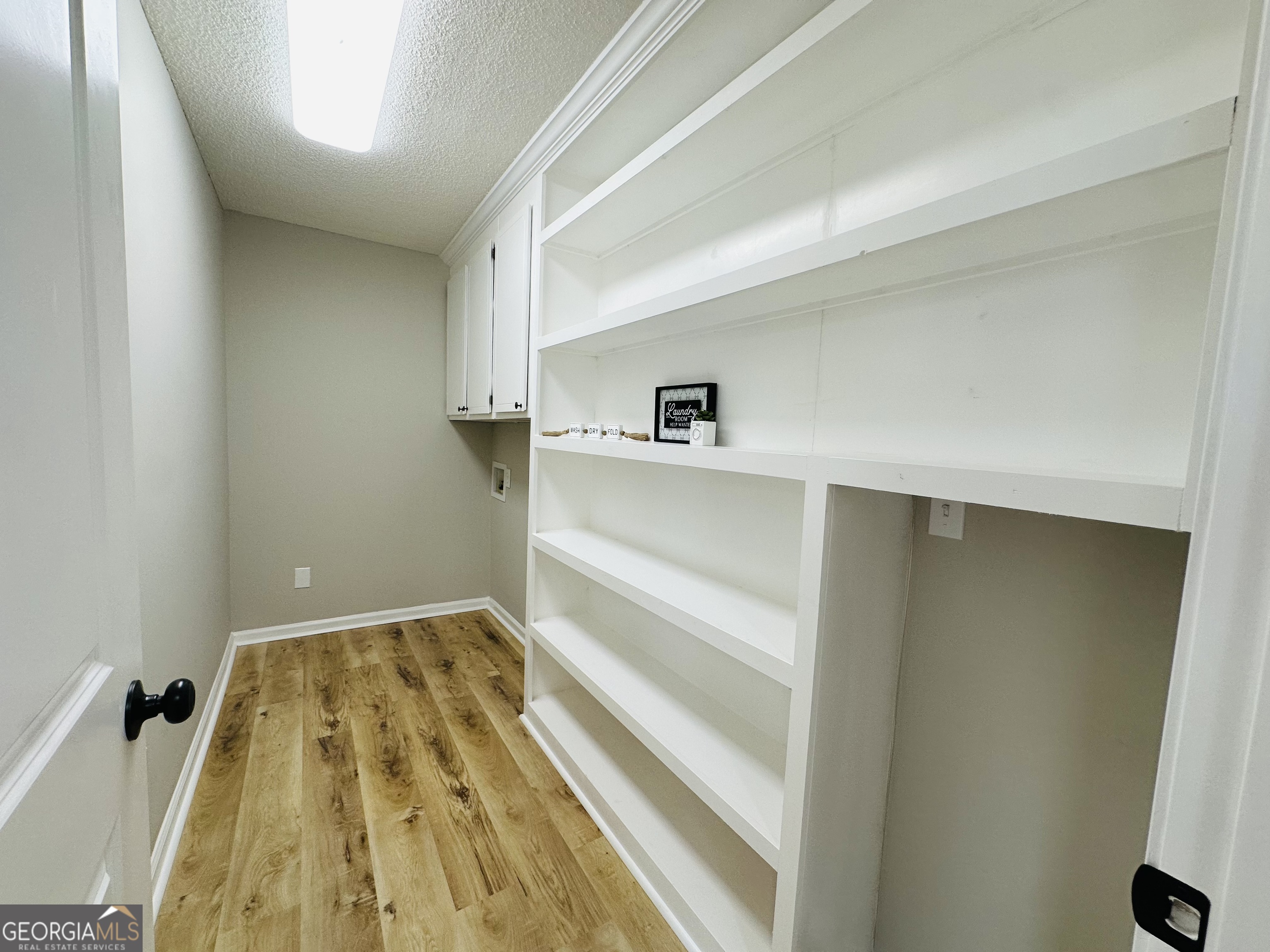 1610 Lance Drive Dublin, GA 31021 - Photo 17 of 38 a view of a bedroom with wooden floor and closet