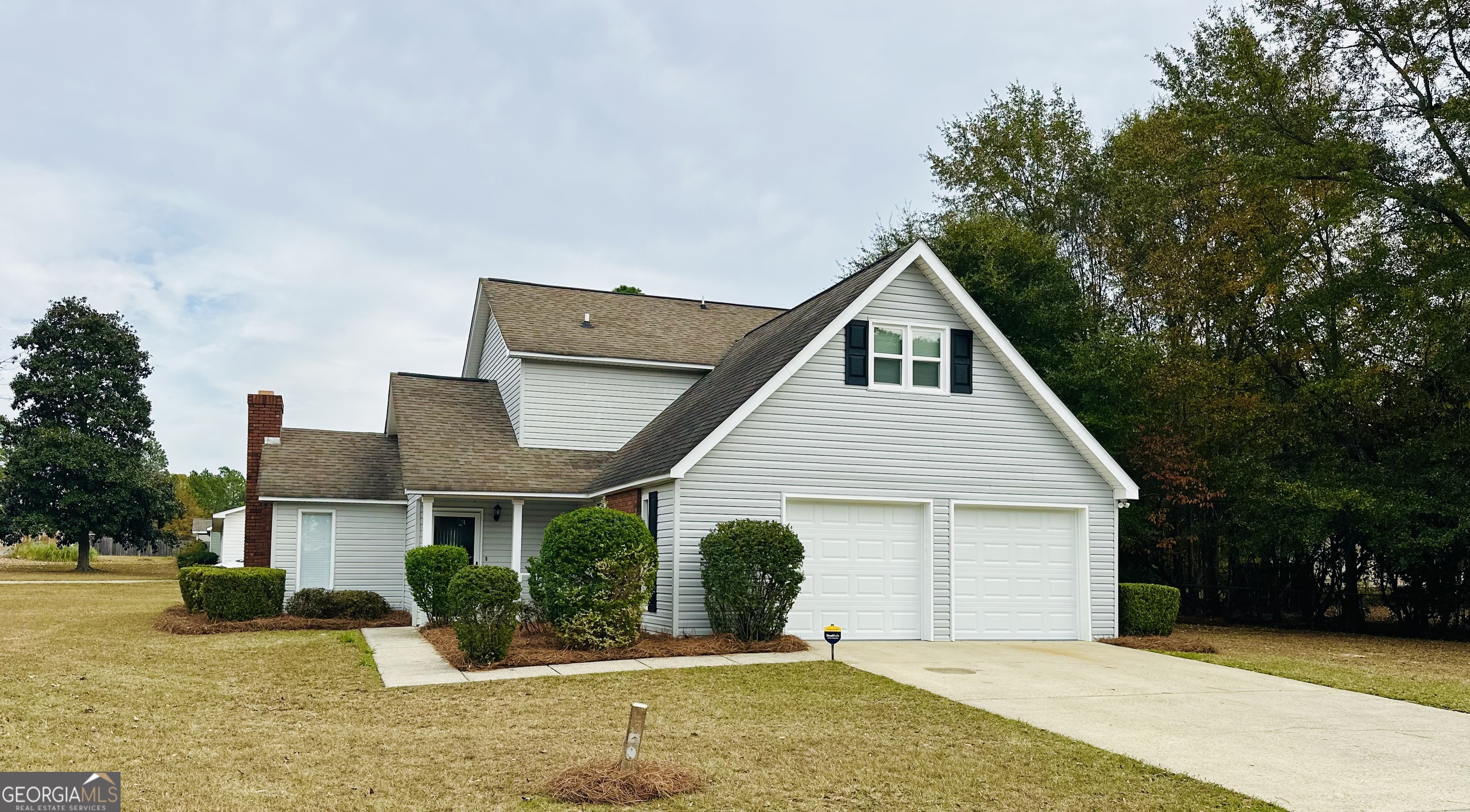 1610 Lance Drive Dublin, GA 31021 - Photo 3 of 38 a front view of a house with yard and garage