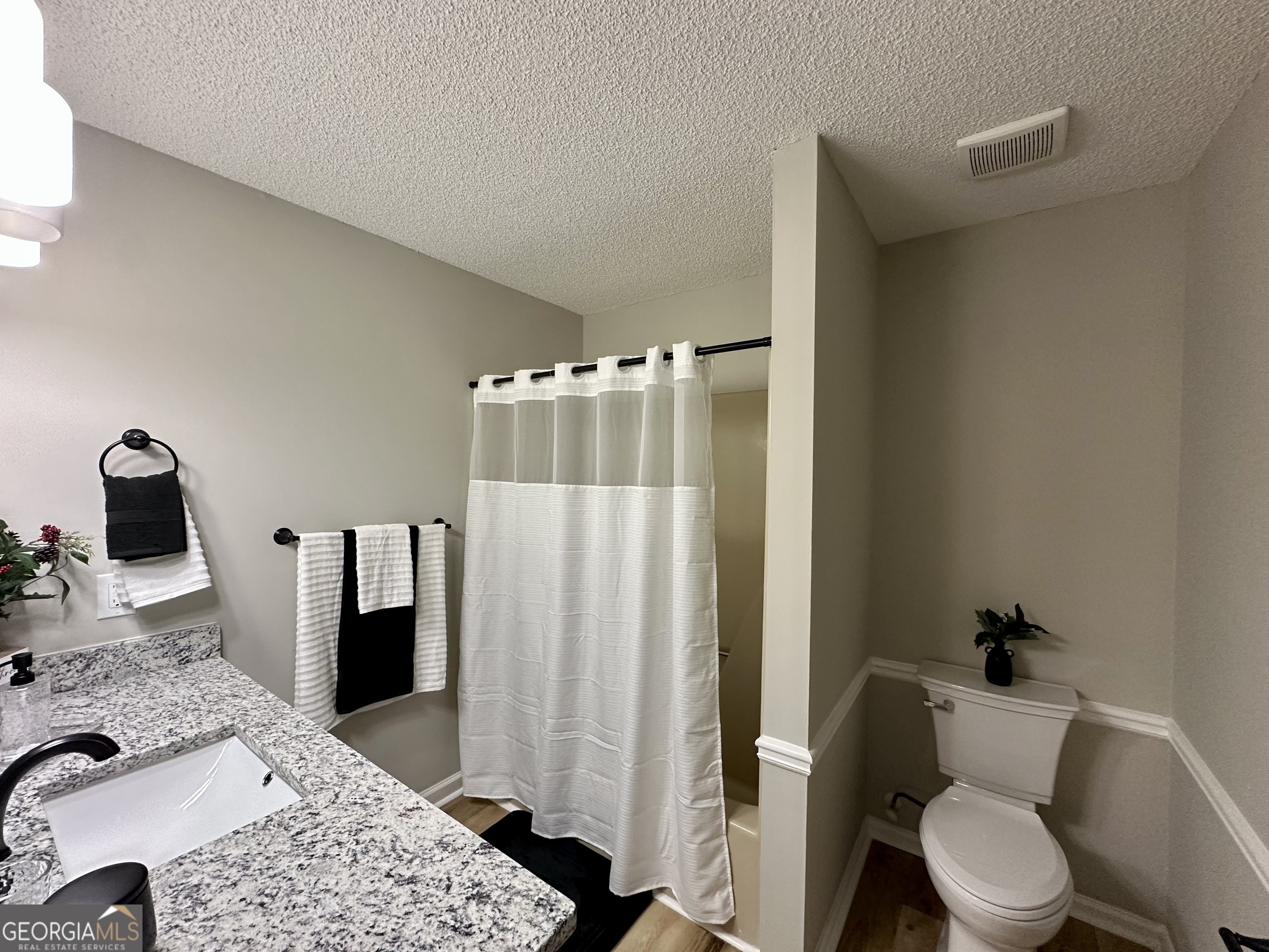 1610 Lance Drive Dublin, GA 31021 - Photo 32 of 38 a bathroom with a toilet and a shower