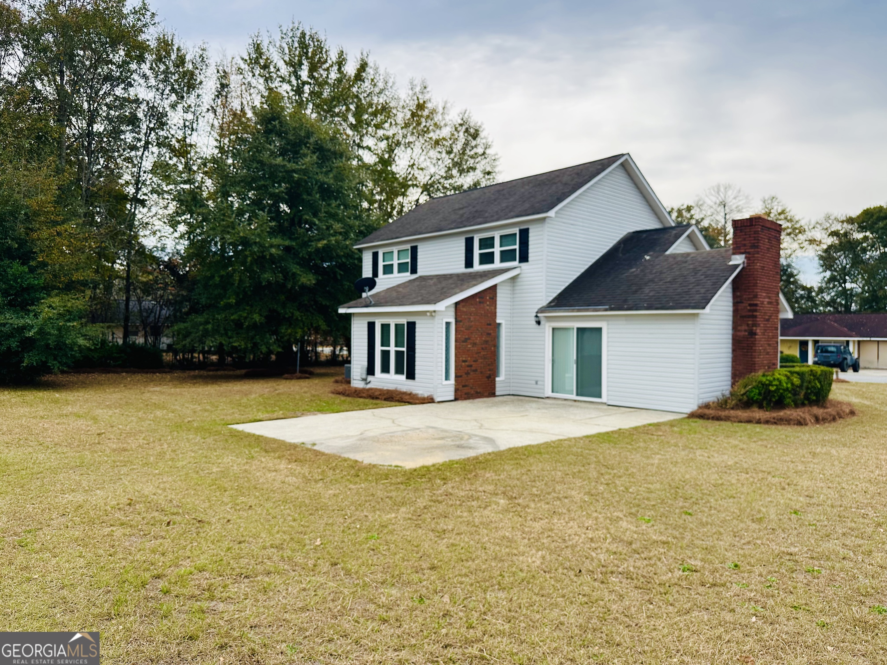 1610 Lance Drive Dublin, GA 31021 - Photo 4 of 38 a front view of house with yard and trees in the background